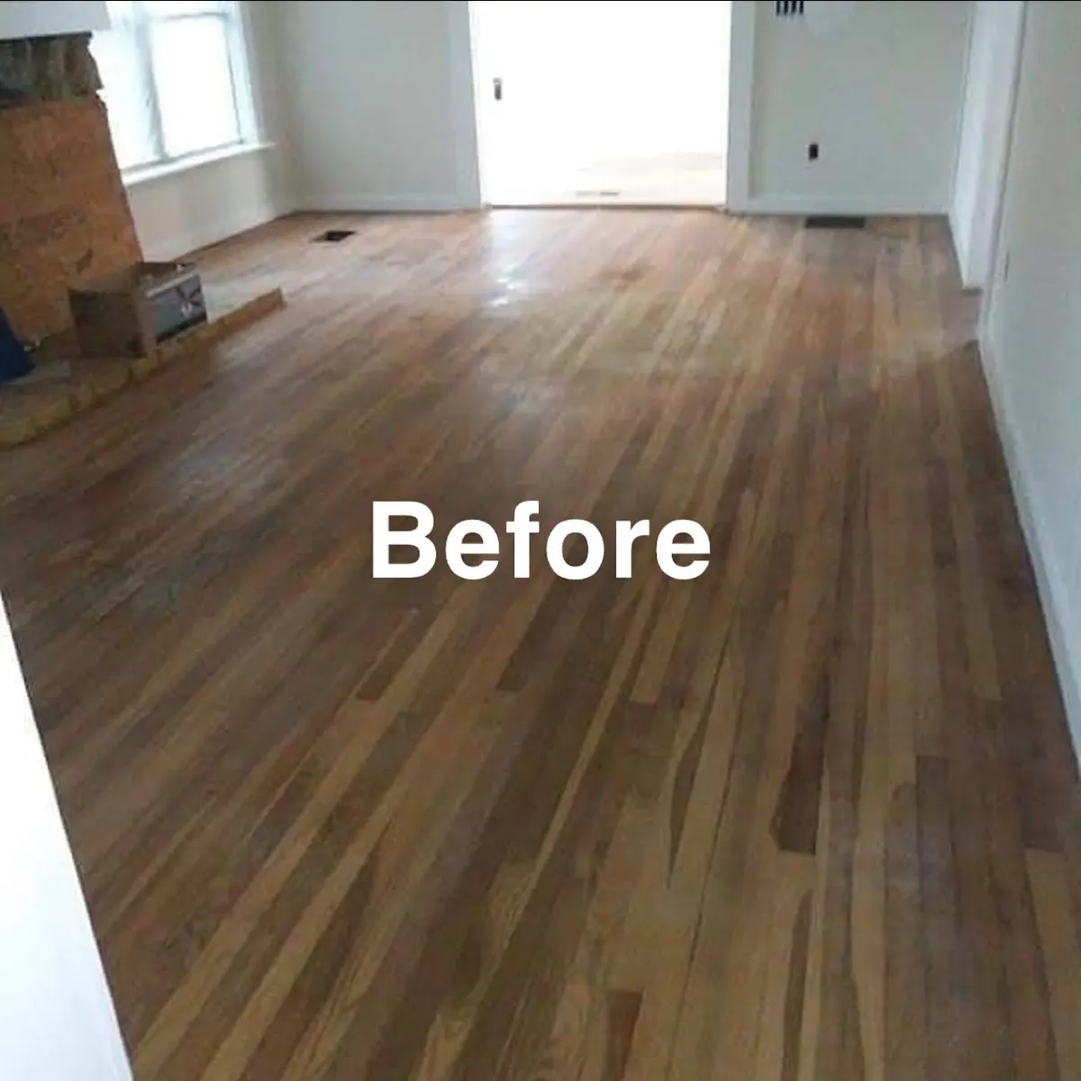 Hardwood floor before refinishing, dull with worn traffic paths